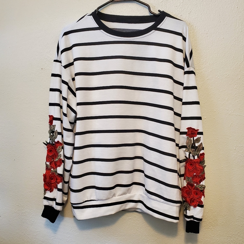 Black and white sweatshirt with red applique